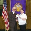 Pictured is Elk Past President Michael Taylor with Captain Carrie McCall.